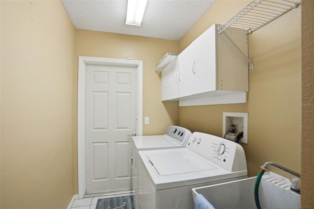 4219 Newton Road Spring Hill, FL 34606 - Photo 29 of 35 a utility room with dryer and washer