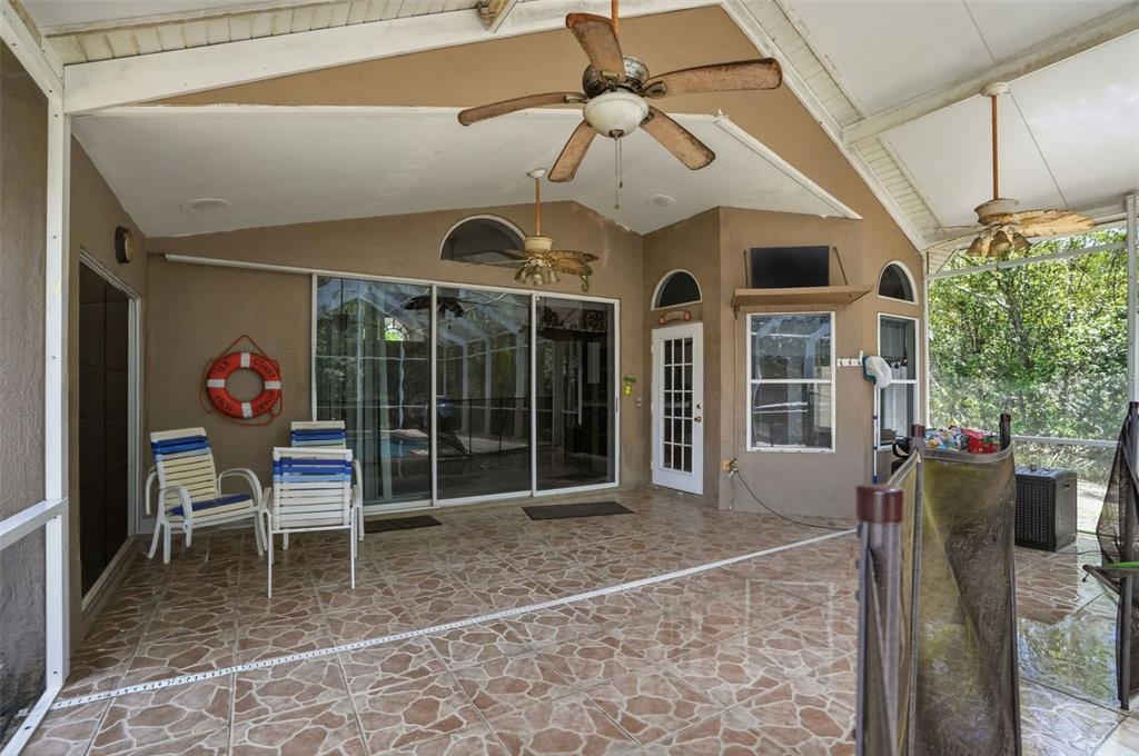 4219 Newton Road Spring Hill, FL 34606 - Photo 31 of 35 a view of a chairs and table in a patio