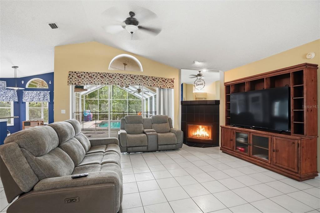 4219 Newton Road Spring Hill, FL 34606 - Photo 5 of 35 a living room with furniture and a flat screen tv