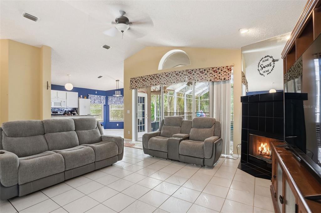 4219 Newton Road Spring Hill, FL 34606 - Photo 6 of 35 a living room with furniture and a flat screen tv