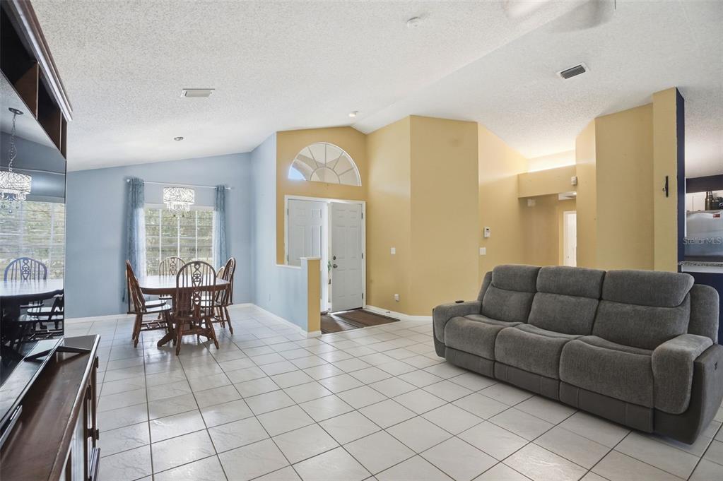 4219 Newton Road Spring Hill, FL 34606 - Photo 8 of 35 a living room with furniture and a window