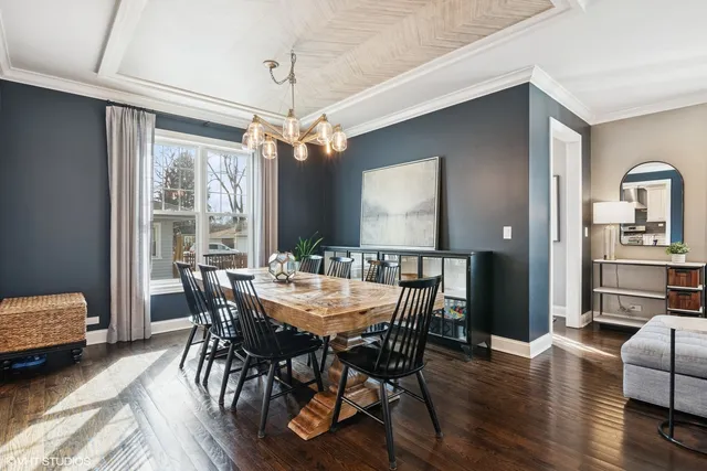 a bedroom with a bed couch and a large window