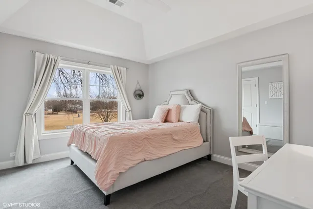 a view of a chairs and table in the back yard of the house