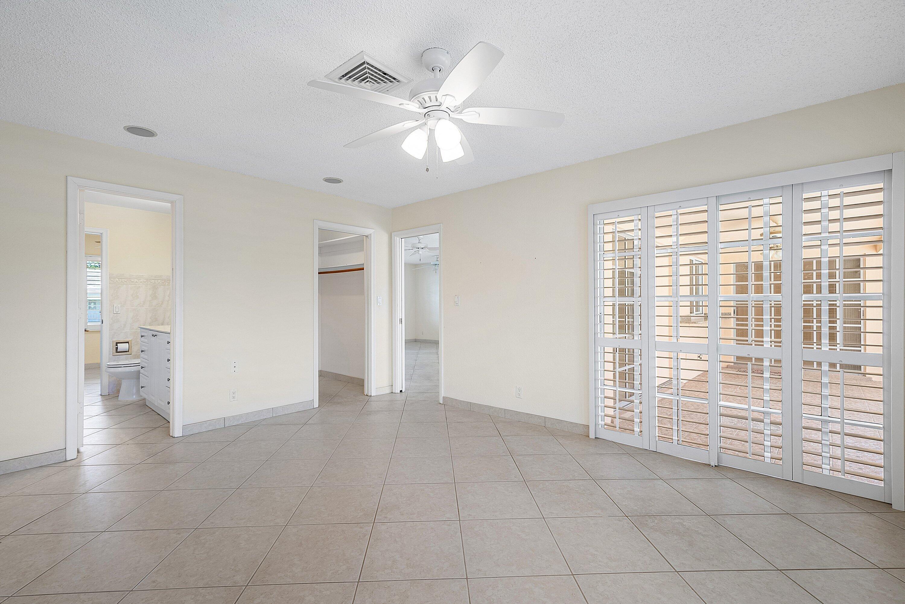 480 Northwest 11th Avenue Boca Raton, FL 33486 - Photo 17 of 43 a view of an empty room with a window