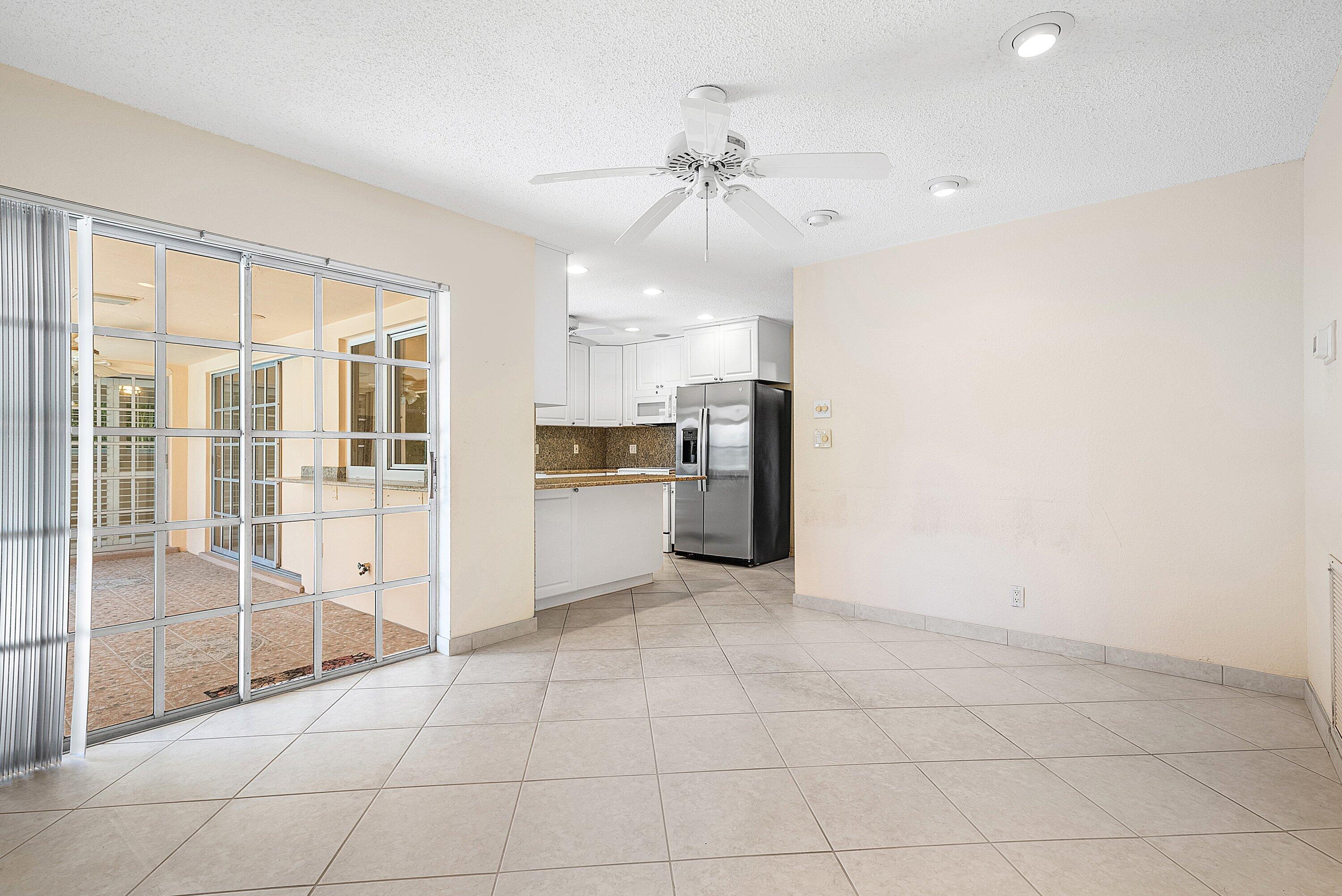 480 Northwest 11th Avenue Boca Raton, FL 33486 - Photo 23 of 43 a view of kitchen with windows and refrigerator