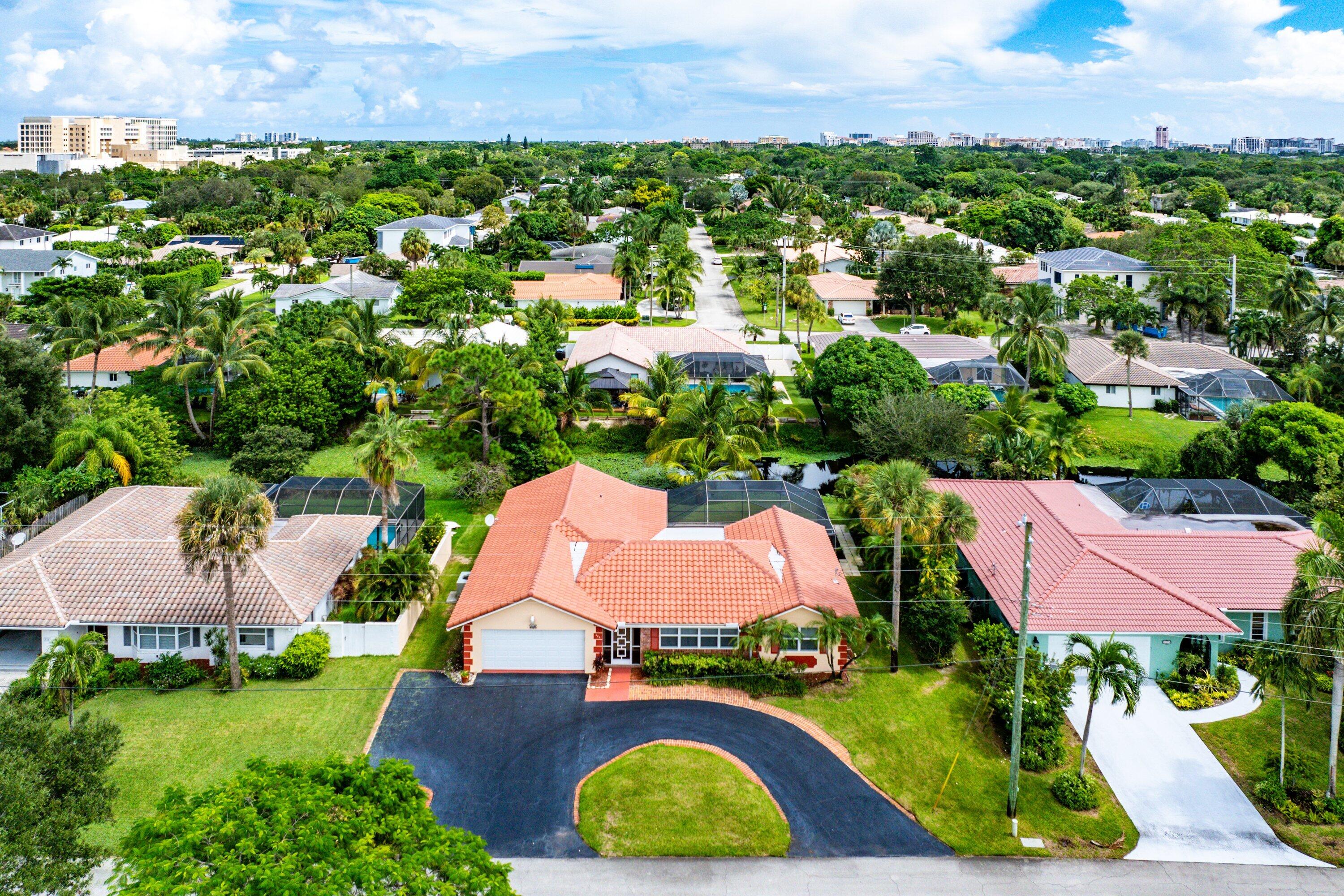 480 Northwest 11th Avenue Boca Raton, FL 33486 - Photo 39 of 43 an aerial view of house with yard swimming pool and outdoor seating