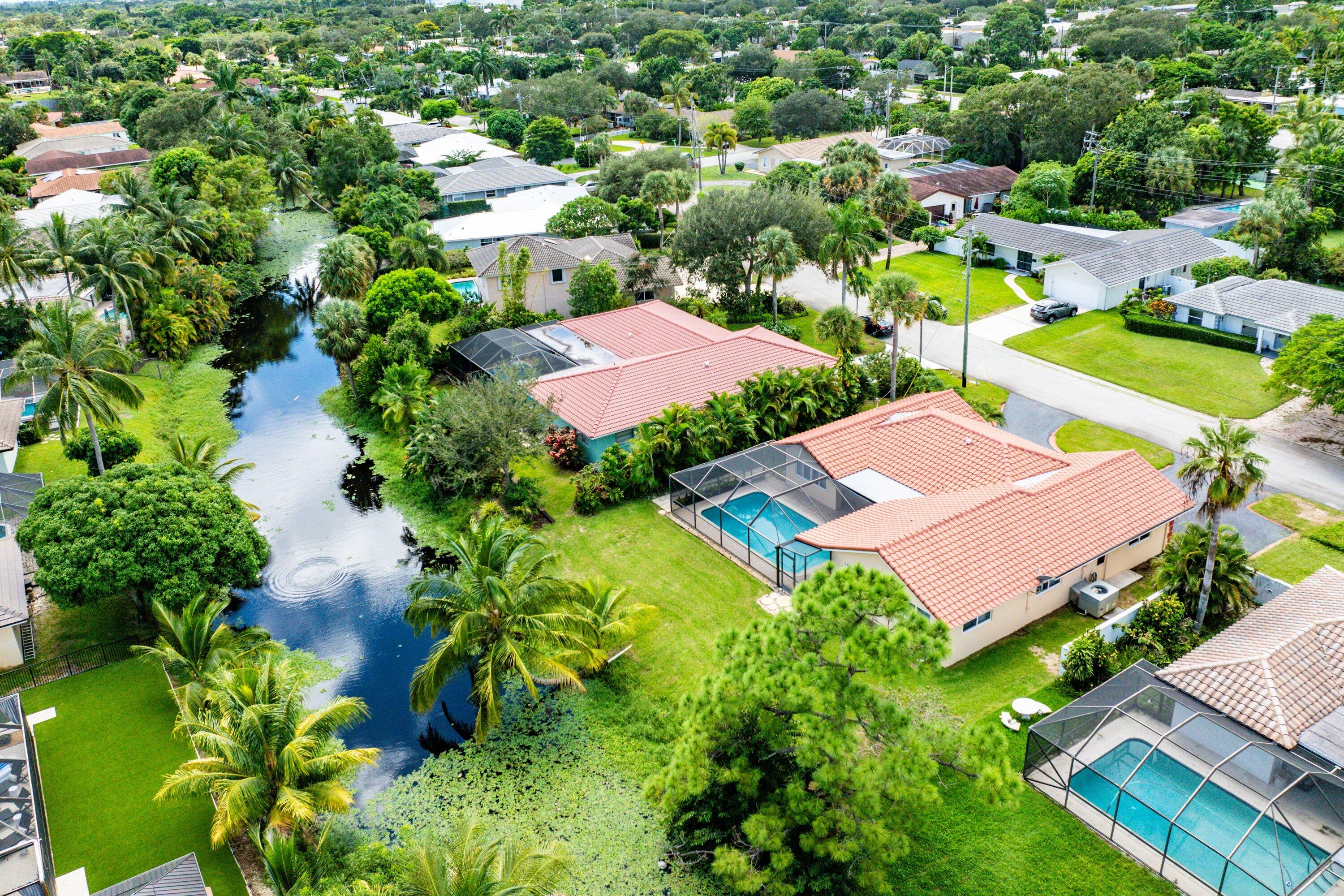 480 Northwest 11th Avenue Boca Raton, FL 33486 - Photo 42 of 43 an aerial view of residential houses with outdoor space and street view