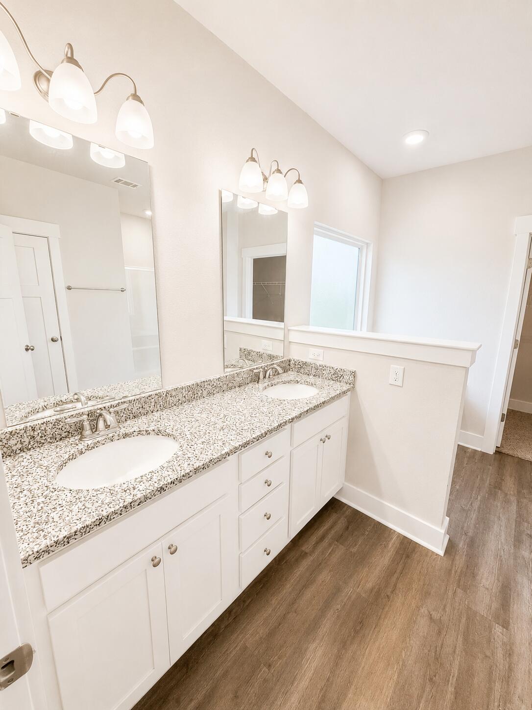734 Quintana Street Crestview, FL 32539 - Photo 12 of 16 a bathroom with a granite countertop double vanity sink and mirror