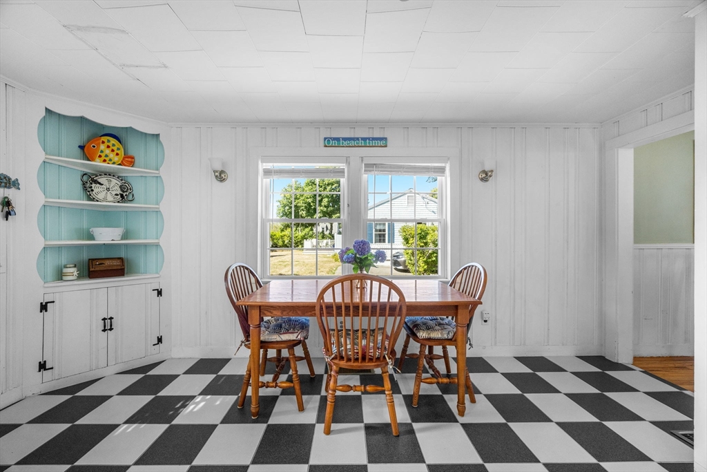 7 Spruce Drive Bourne, MA 02559 - Photo 14 of 39 a view of a dining room with a table and chairs
