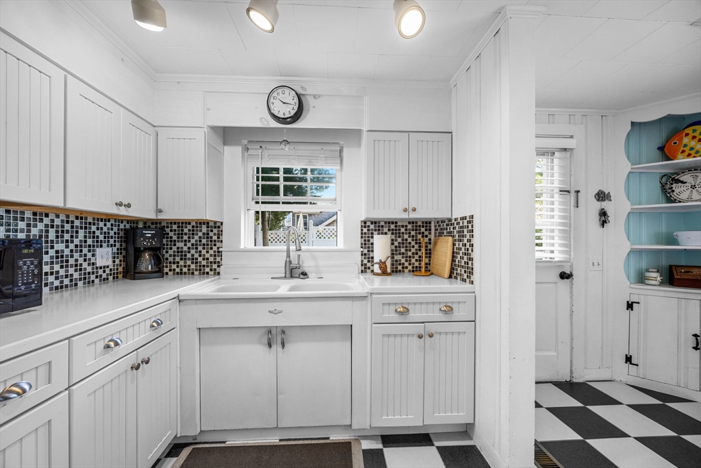 7 Spruce Drive Bourne, MA 02559 - Photo 17 of 39 a kitchen with stainless steel appliances a sink and cabinets