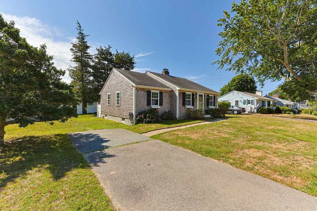 7 Spruce Drive Bourne, MA 02559 - Photo 27 of 39 a view of a house with a swimming pool