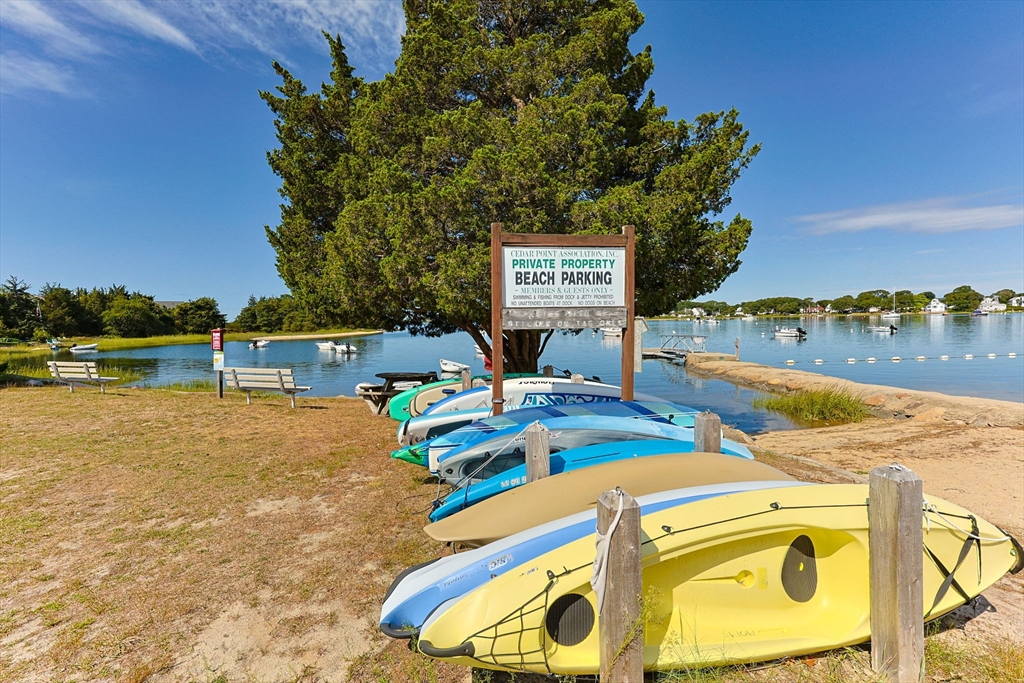 7 Spruce Drive Bourne, MA 02559 - Photo 28 of 39 a view of a swimming pool with a lawn chairs