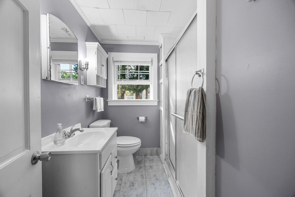 7 Spruce Drive Bourne, MA 02559 - Photo 8 of 39 a bathroom with a sink a toilet and a mirror