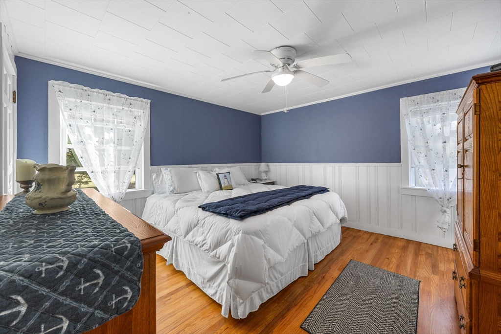 7 Spruce Drive Bourne, MA 02559 - Photo 9 of 39 a bedroom with a bed and wooden floor