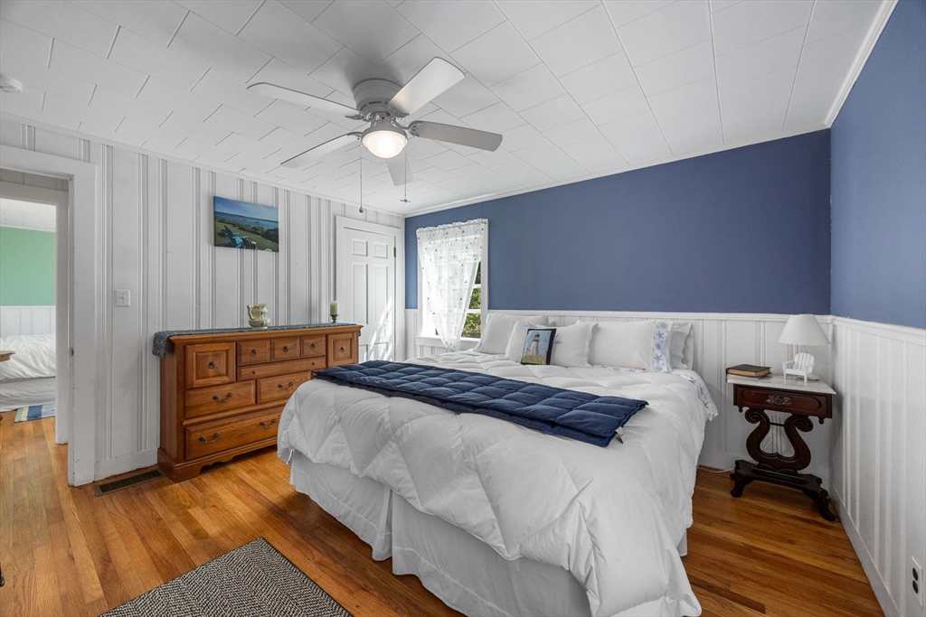 7 Spruce Drive Bourne, MA 02559 - Photo 10 of 39 a bedroom with a bed and a dresser