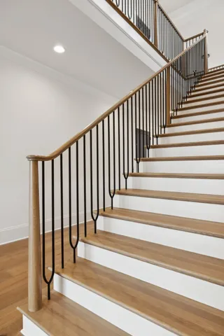 a view of an empty room with glass door and a window