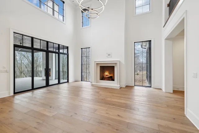 a kitchen with granite countertop a refrigerator and a sink
