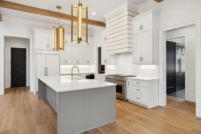 a large spacious bathroom with a large tub a double vanity sink and mirror