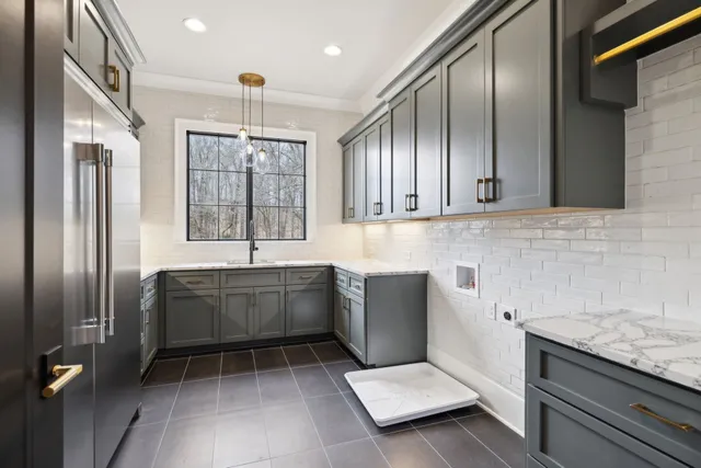 a bathroom with a granite countertop sink toilet a mirror and shower