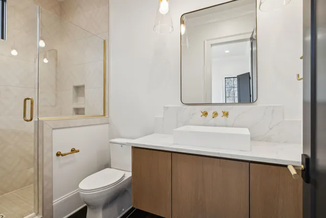 a bathroom with a shower and closet