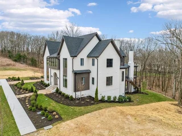 a view of a big room with wooden floor and a bathroom