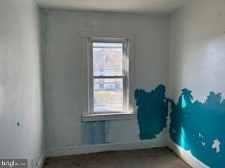 273 Broad Street Carneys Point, NJ 08069 - Photo 10 of 14 a green room with windows and stairs