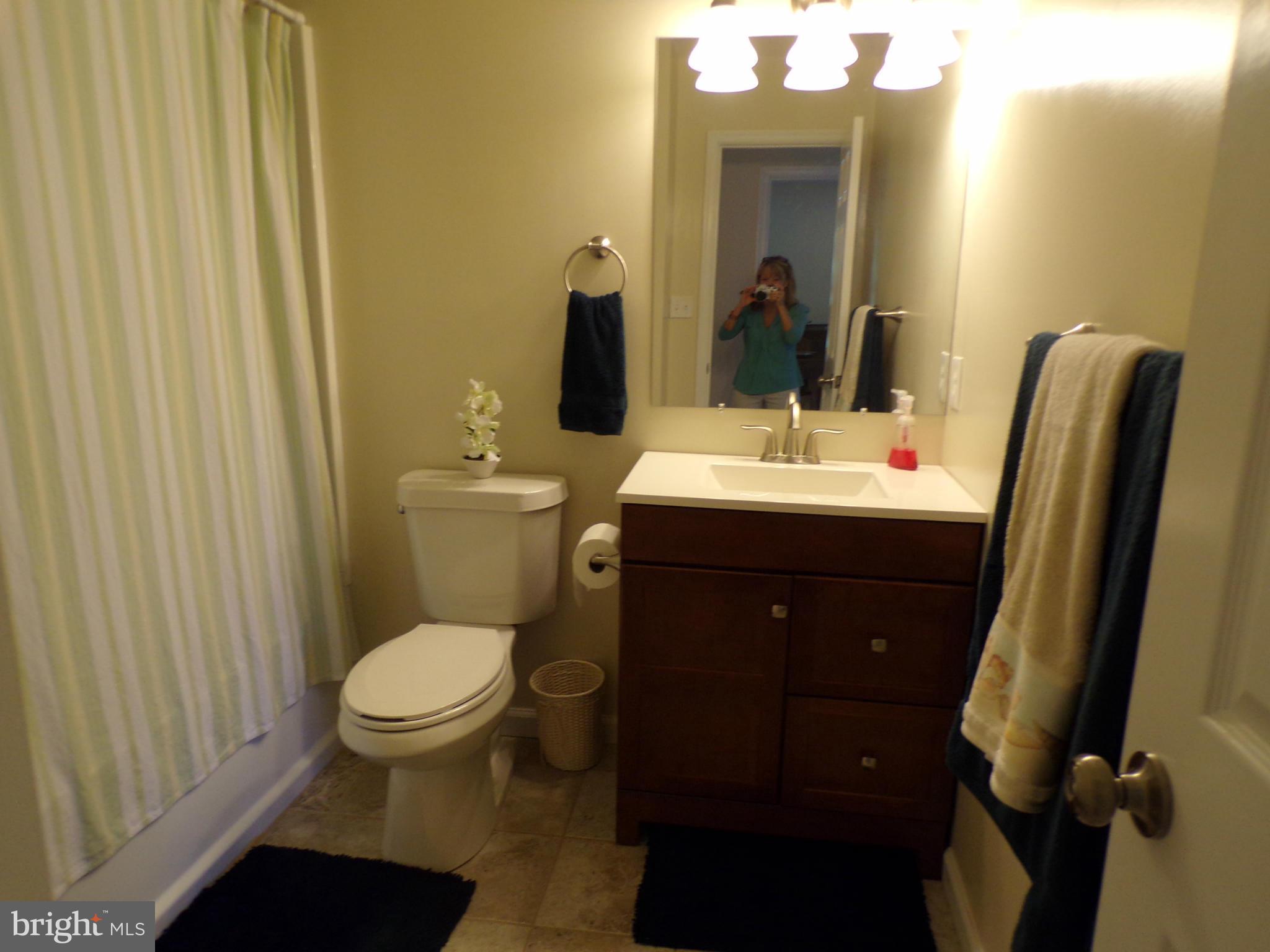 520 Brentwood Road Edgewater, MD 21037 - Photo 15 of 18 a bathroom with a toilet a sink and mirror
