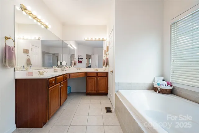 a large kitchen with a sink and cabinets