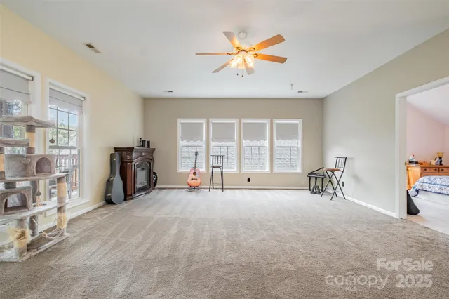 a view of a livingroom with workspace and a window