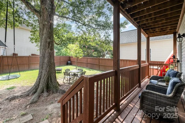 a view of balcony with wooden floor and outdoor seating