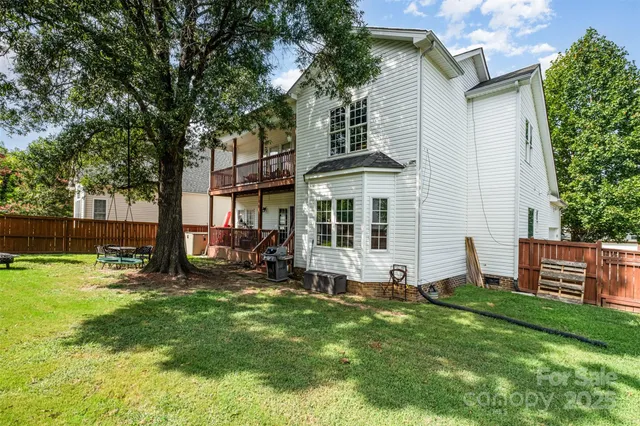 a view of a house with a yard porch and sitting area