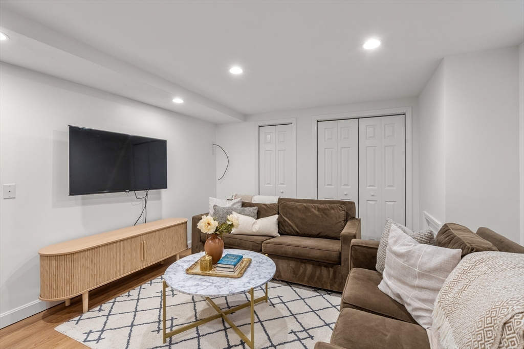 322 Concord Road Wayland, MA 01778 - Photo 27 of 35 a living room with furniture and a flat screen tv