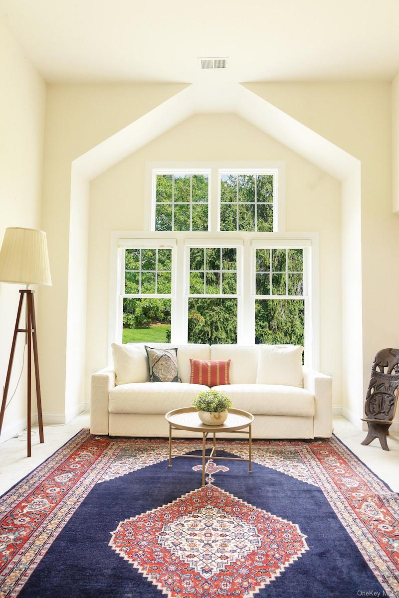 66 Landing Drive Dobbs Ferry, NY 10522 - Photo 27 of 44 a living room with furniture and a rug