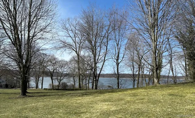 a living room filled with furniture and a window