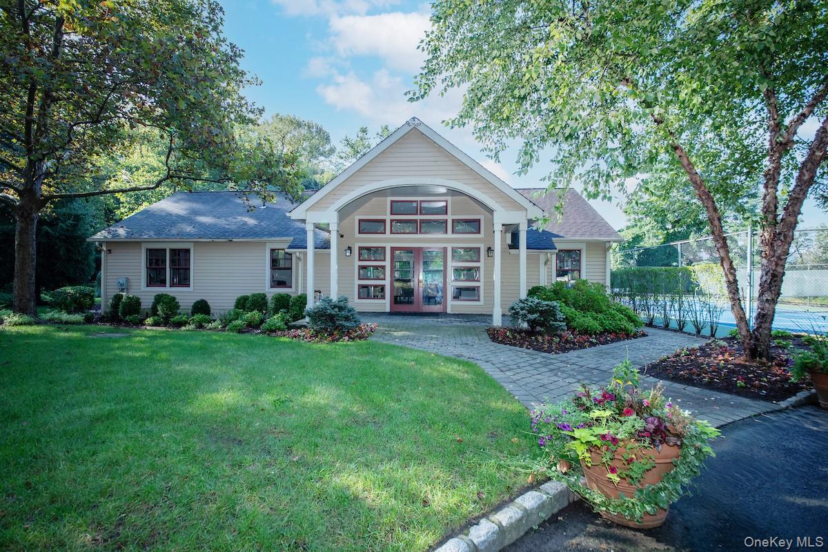 66 Landing Drive Dobbs Ferry, NY 10522 - Photo 37 of 44 a front view of a house with a yard and garden