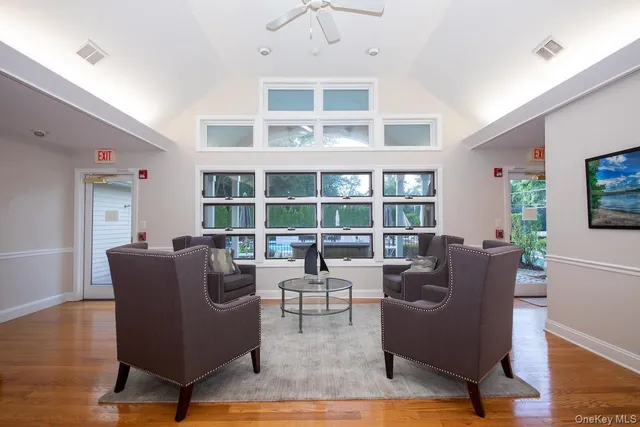 a view of tennis court with wooden fence