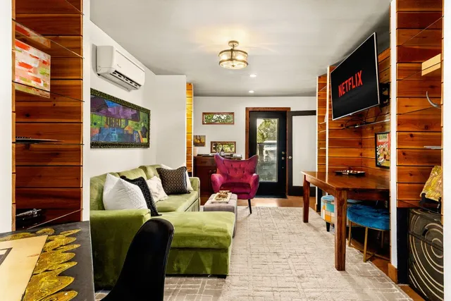a living room with furniture and a window