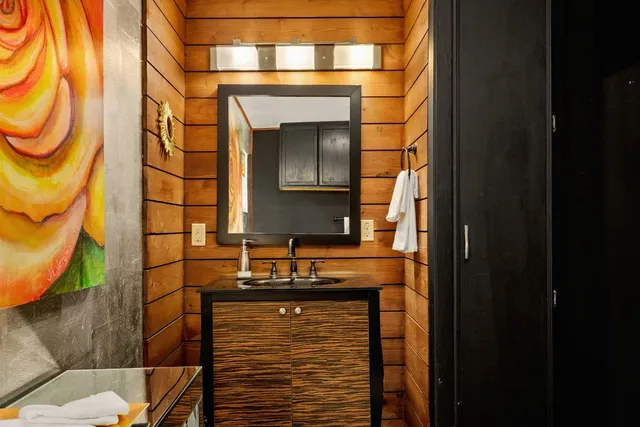 a bathroom with a toilet sink and shower