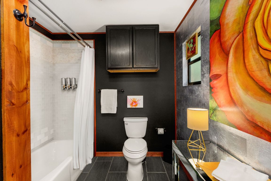 303 Lange Road Wimberley, TX 78676 - Photo 20 of 31 a bathroom with a toilet sink and shower