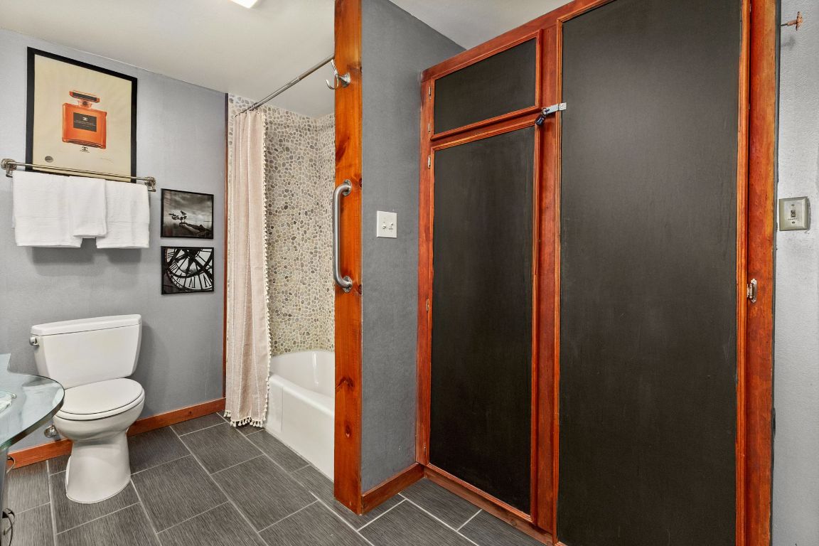 303 Lange Road Wimberley, TX 78676 - Photo 22 of 31 a bathroom with a toilet and a shower