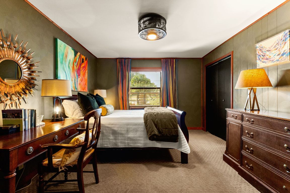 303 Lange Road Wimberley, TX 78676 - Photo 24 of 31 a bedroom with furniture and a window