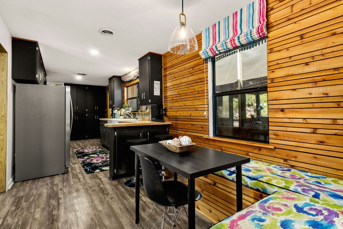 303 Lange Road Wimberley, TX 78676 - Photo 3 of 31 a view of a chairs and table in a patio