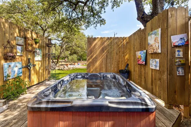 a view of a backyard with sitting area