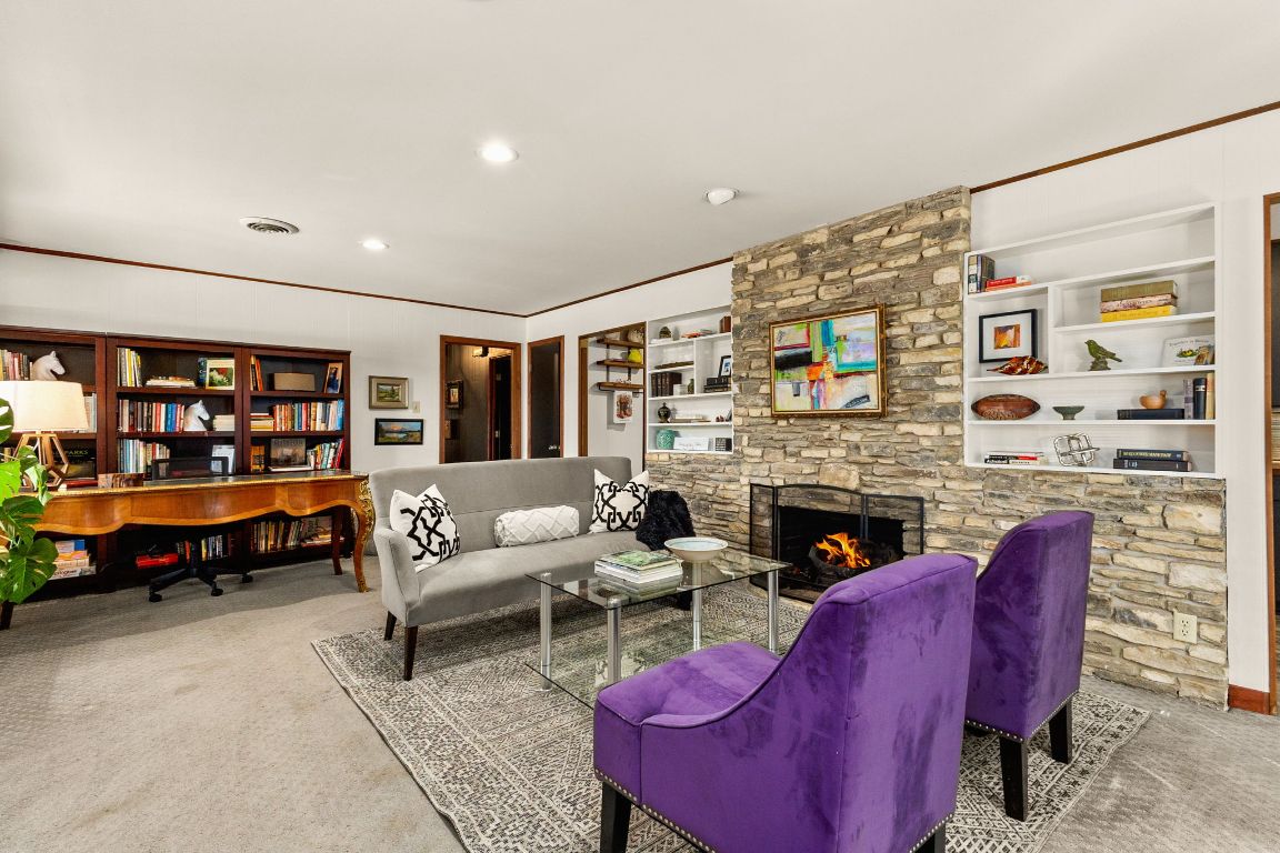 303 Lange Road Wimberley, TX 78676 - Photo 9 of 31 a living room with furniture and a fireplace