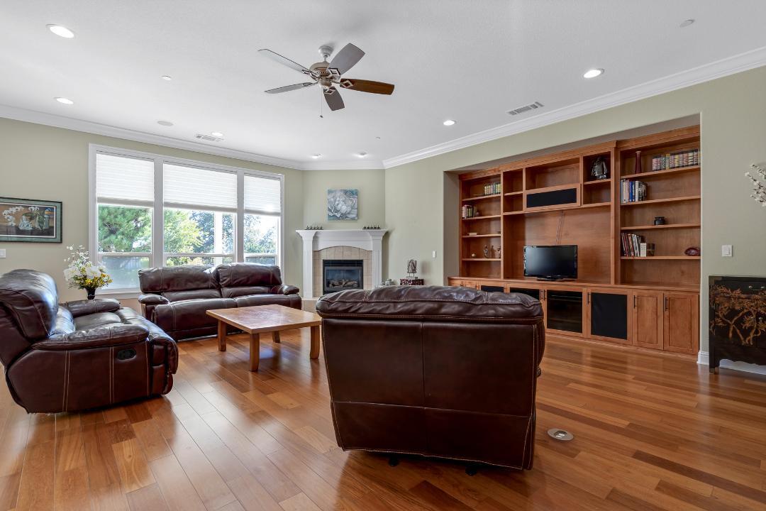 3685 Wimbledon Drive Redding, CA 96002 - Photo 15 of 70 a living room with furniture and a flat screen tv