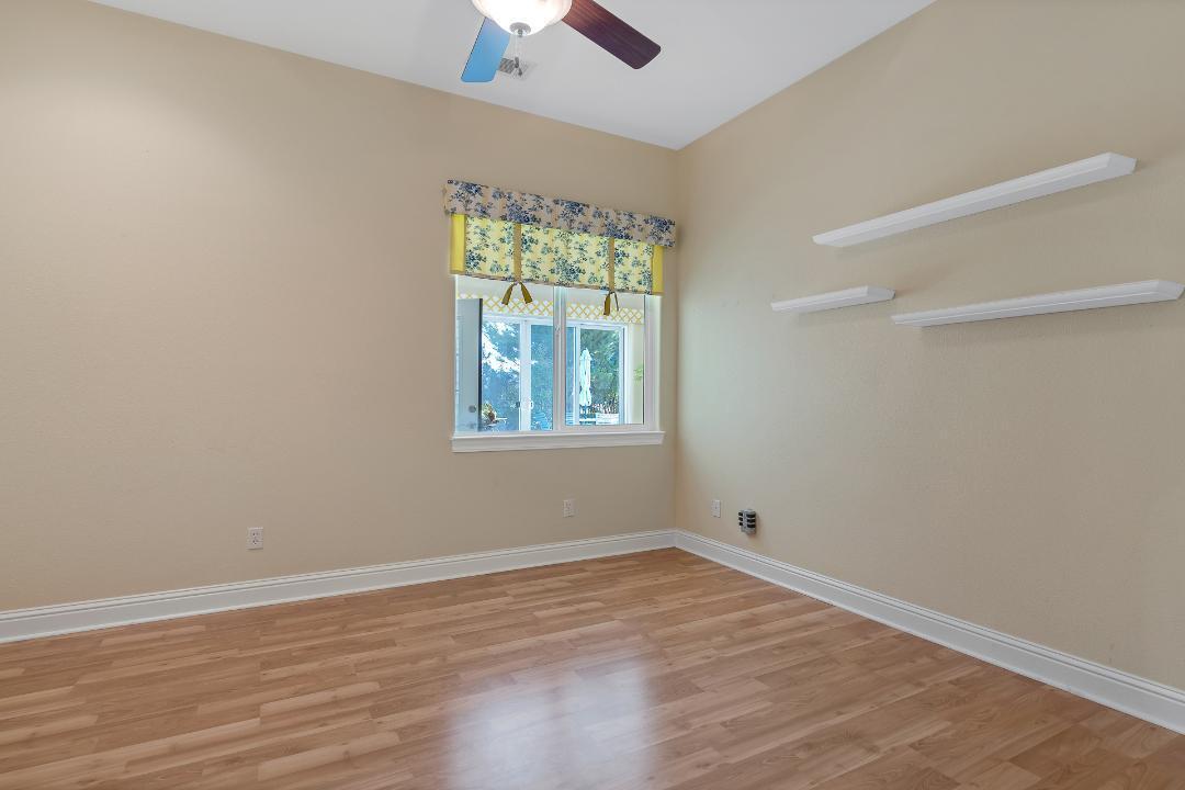 3685 Wimbledon Drive Redding, CA 96002 - Photo 32 of 70 wooden floor in an empty room with a window