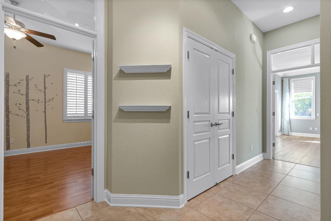3685 Wimbledon Drive Redding, CA 96002 - Photo 40 of 70 a view of a hallway with wooden floor and a bathroom