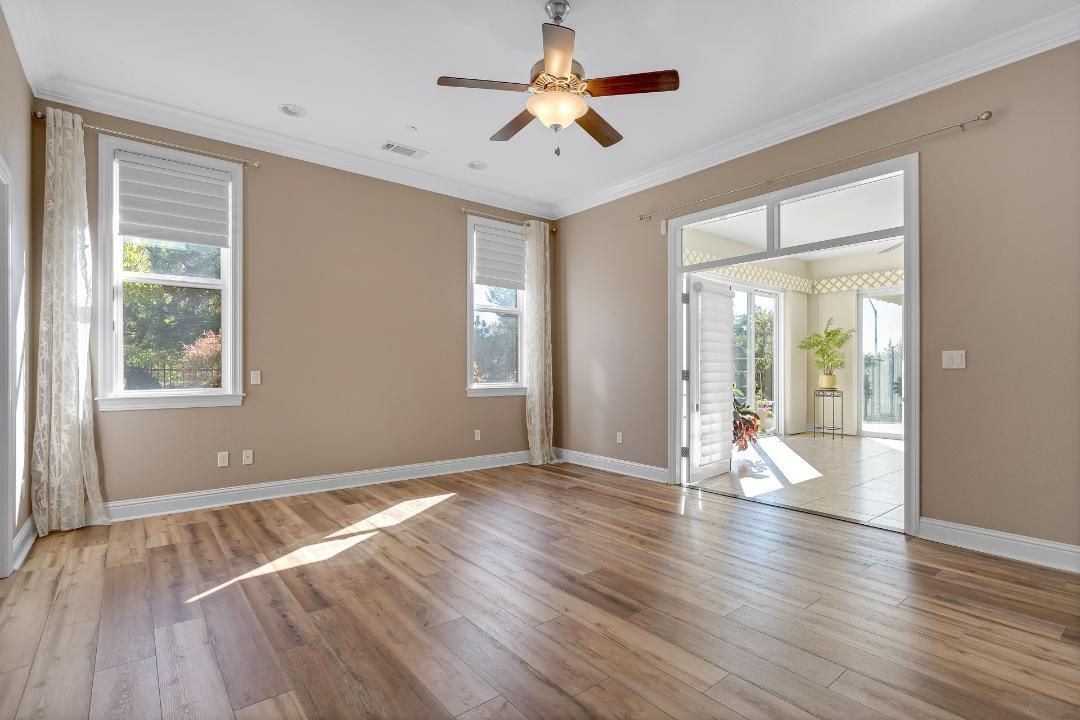 3685 Wimbledon Drive Redding, CA 96002 - Photo 42 of 70 a view of empty room with wooden floor and fan
