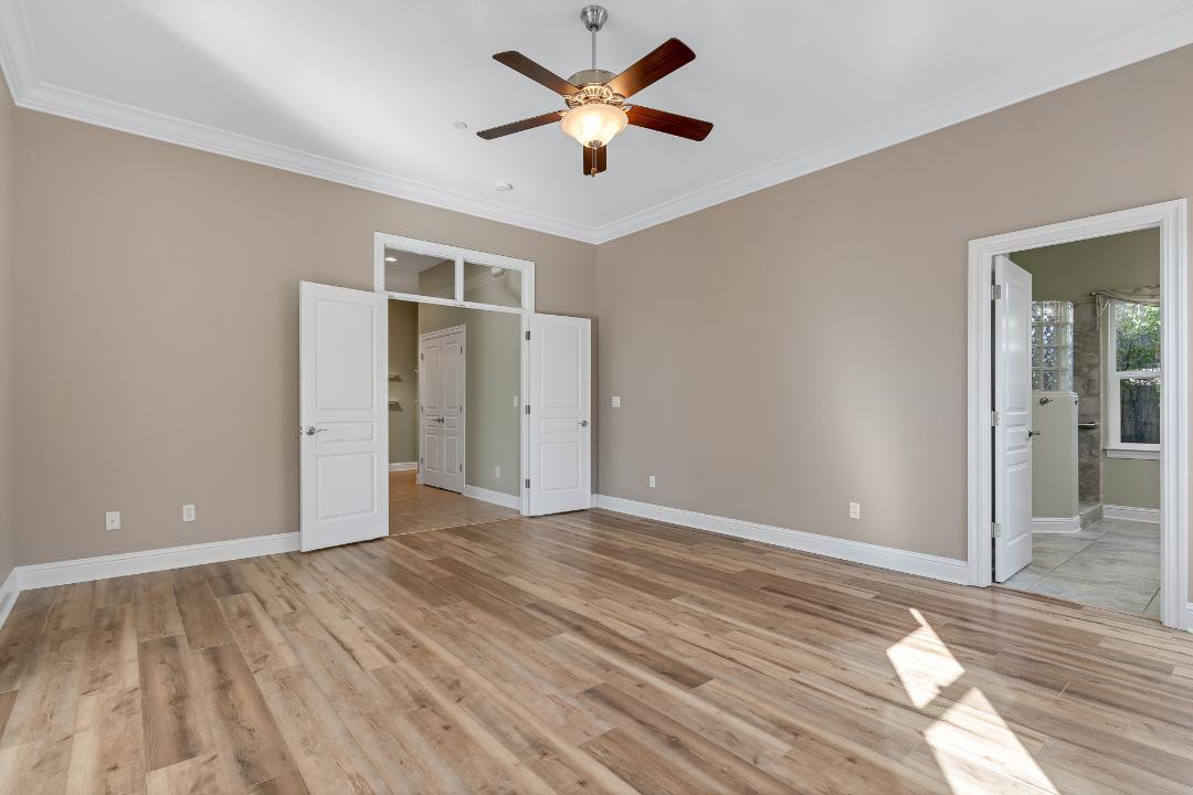 3685 Wimbledon Drive Redding, CA 96002 - Photo 44 of 70 a view of an empty room and window and a ceiling fan
