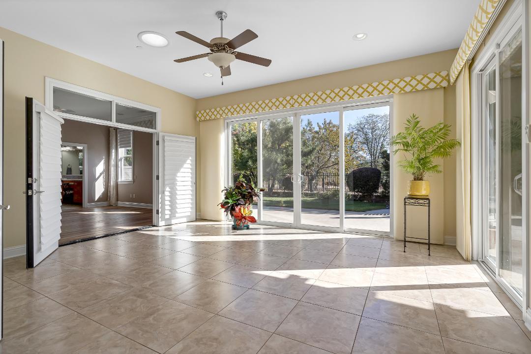 3685 Wimbledon Drive Redding, CA 96002 - Photo 55 of 70 a view of an entryway with a floor to ceiling window and an outdoor space